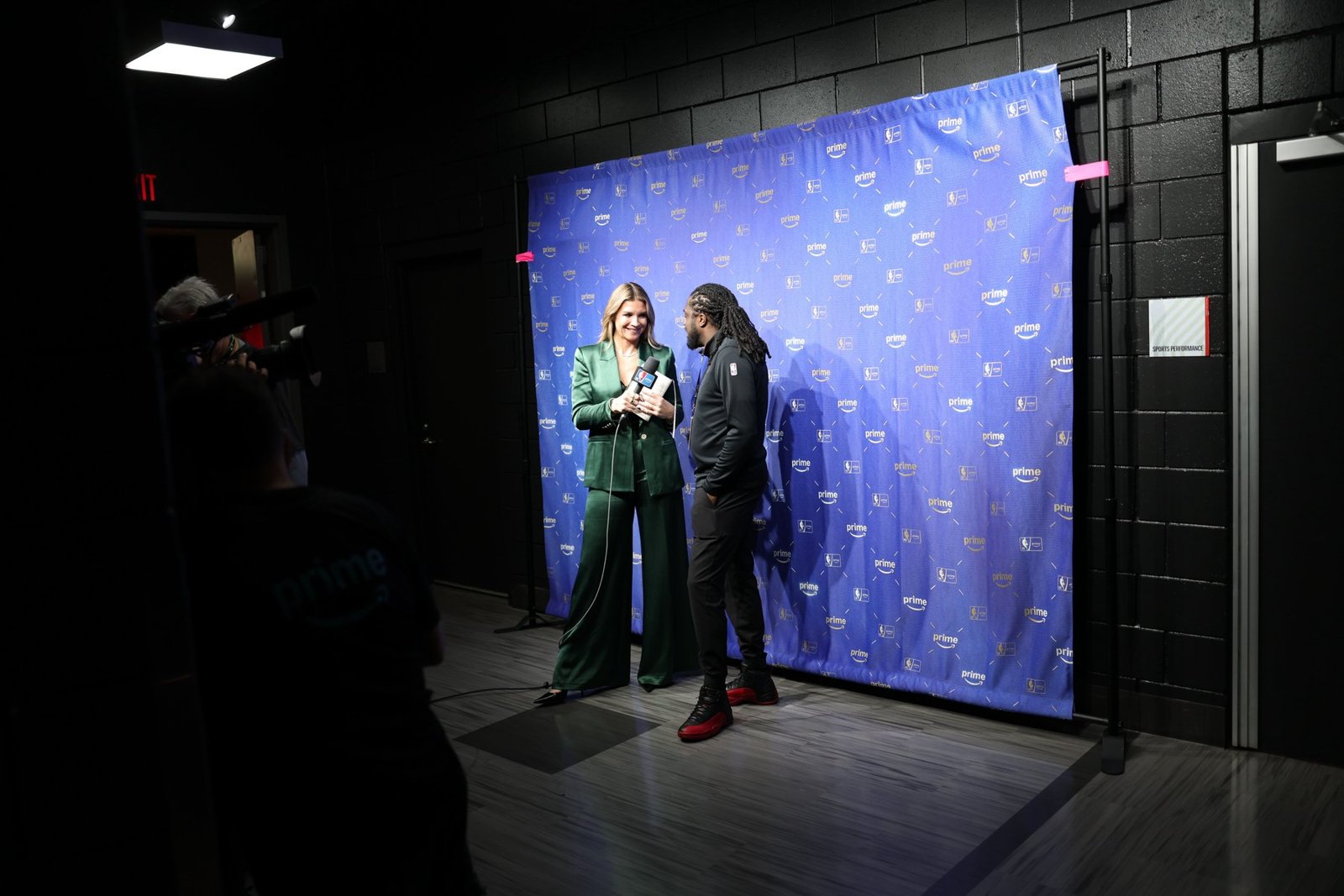 A communications professional and reporter during an on-camera interview